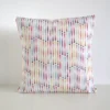 Multi coloured geometric cushion cover featuring a small twisted stripe shape pattern